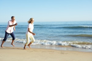 Senior Couple Enjoying Romantic Beach Holiday